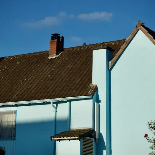 Suburban house exterior ready for soft-wash cleaning